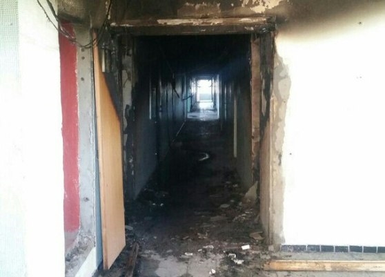 От огня и дыма пострадал общий коридор в доме на Революционной