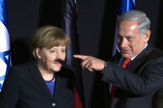 Ангела Меркель с усами, образованными тенью от пальца 